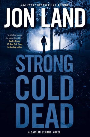 This book cover image released by Forge Books shows "Strong Cold Dead," by Jon Land. (Forge via AP)