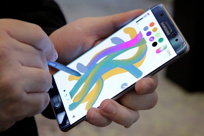 In this July 28, 2016, file photo, a color blending feature of the Galaxy Note 7 is demonstrated in New York. (AP Photo/Richard Drew, File)