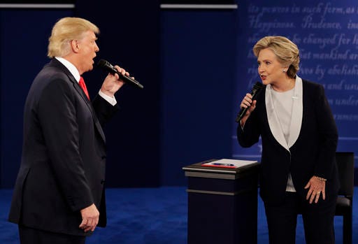 Republican presidential nominee Donald Trump and Democratic presidential nominee Hillary Clinton speak during the second presidential debate at Washington University in St. Louis, Sunday.