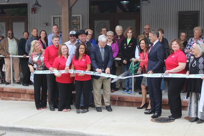 Ellis County Judge Carol Bush had the honor of cutting the ceremonial ribbon that formally opened the new Ellis County Elections Office on Friday. County, city and state dignitaries were on hand to usher the former blacksmith shop into its new role as the county's polling headquarters.