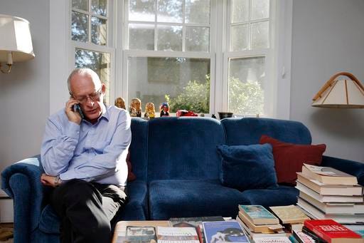 Oliver Hart, the Andrew E. Furer Professor of Economics at Harvard, speaks on the phone at his home in Lexington, Mass., Monday, Oct. 10, 2016, after winning the Nobel Prize in economics. Hart and Finnish economist Bengt Holmstrom, of the Massachusetts Institute of Technology, share the award for their contributions to contract theory. (AP Photo/Michael Dwyer)