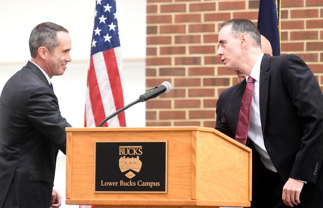 8th Congressional District candidates Steve Santarsiero (left) and Brian Fitzpatrick shake hands prior to their debate at the Lower Bucks campus of Bucks County Community College in Bristol Township on Thursday, Oct. 13, 2016.