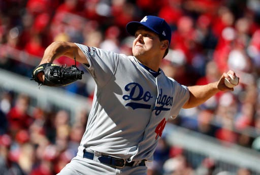 Los Angeles Dodgers starting pitcher Rich Hill throws in the third inning during Game 2 of baseball's National League Division Series against the Washington Nationals at Nationals Park, Sunday, Oct. 9, 2016, in Washington. (AP Photo/Alex Brandon)