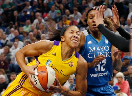 Los Angeles Sparks"™ Candace Parker, left, drives past Minnesota Lynx"™s Rebekkah Brunson during the first quarter of Game 2 of the WNBA basketball finals Tuesday, Oct. 11, 2016, in Minneapolis. (AP Photo/Jim Mone)