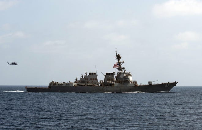 In this image released by the U.S. Navy, the USS Mason (DDG 87), conducts maneuvers as part of a exercise in the Gulf of Oman on Sept. 10, 2016. For the second time this week two missiles were fired at the USS Mason in the Red Sea, and officials believe they were launched by the same Yemen-based Houthi rebels involved in the earlier attack, a U.S. military official said Wednesday. According to the official, the missiles were fired early Oct. 12 at the USS Mason that is conducting routine operations in the region, along with the USS Ponce, an amphibious warship. The official said that neither missile got near the ship. (Mass Communication Specialist 1st Class Blake Midnight/U.S. Navy via AP)