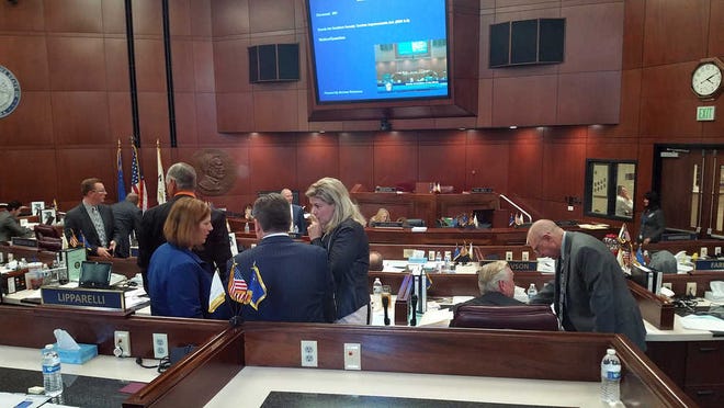 Republican lawmakers huddle as they discuss a bill during a special legislative session in Carson City, Nev., Tuesday, Oct. 11, 2016. The Nevada Legislature is deliberating bills that would authorize public funds for an NFL stadium and convention center expansion in Las Vegas. (AP Photo/Michelle Rindels)