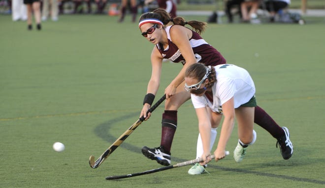 Stroudsburg's Julianna Sweeney, rear, knocks the ball away from Emmaus' Chloe Tostevin during their field hockey game on Sept. 22 in Emmaus. (Keith R. Stevenson/Pocono Record)
