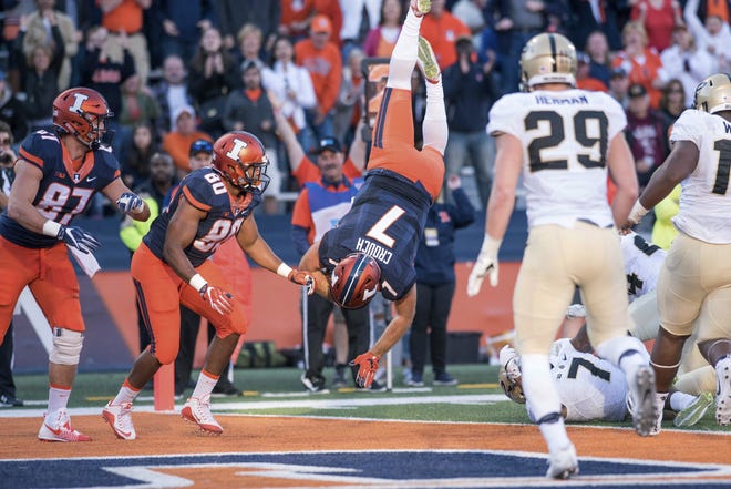 Illinois quarterback Chayce Crouch tumbles into the end zone for a touchdown Saturday in the second half against Purdue at Memorial Stadium. Bradley Leeb/The Associated Press