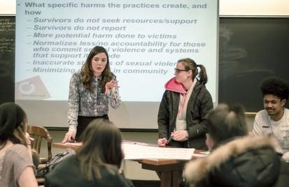 In this April 2016, photo provided by Breakthrough, Columbia University graduate student Savannah Badalich leads a Breakthrough Campus Catalyst Training with student activists at Syracuse University in Syracuse, N.Y., for Sexual Assault Awareness Month. When news broke that Donald Trump, the Republican nominee for president, had bragged of groping women, and then trivialized it as "locker room talk" it "felt to some students like a repudiation of their efforts.