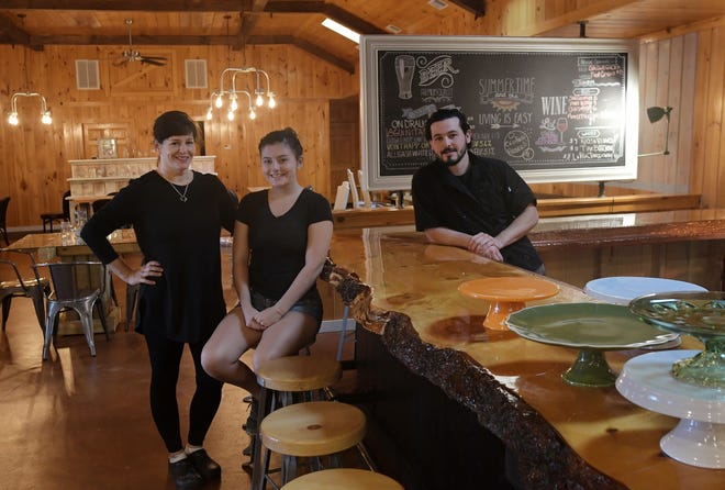 From left, Elaine Pusateri Cowan, owner/chef of UXLocale in Uxbridge, her daughter, Antonia, and son, Charles, at the new restaurant. T&G Staff/Christine Peterson