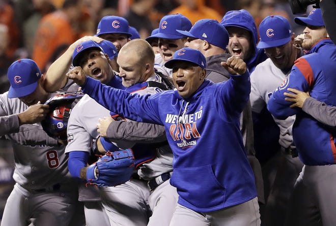 The Chicago Cubs celebrated on Tuesday night after beating the San Francisco Giants in the National League Division Series. (AP Photo/Marcio Jose Sanchez)