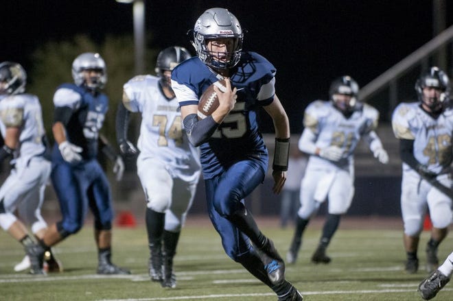 Levi Taylor carries the ball against Hesperia on Sept. 23. (James Quigg, Daily Press File Photo)