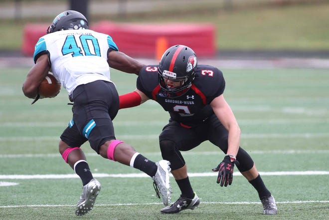GWU's Spencer Havrid, right, tries to take down Coastal Carolina ballcarrier Kenneth Daniels in Saturday's game. Hannah Dunaway/The Star