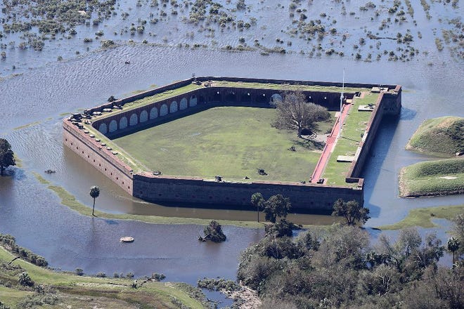 Historic Fort Pulaski National Monument is completely surrounded by flood waters in the aftermath of Hurricane Matthew on Sunday, Oct. 9, just south of Savannah. (Curtis Compton/Atlanta Journal-Constitution via AP)