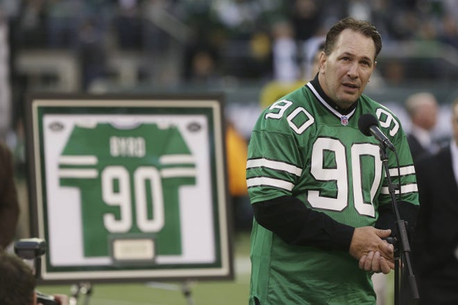 Former Jets defensive player Dennis Byrd speaks at a ceremony to retire his number in 2012. Byrd, who had been paralyzed during a 1992 game and later walked again, died Saturday in a car crash. He was 50. Associated Press