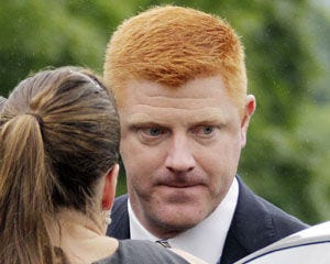 Penn State University assistant football coach Mike McQueary arrives at the Centre County Courthouse to testify in the child sexual abuse trial of former Penn State University assistant football coach Jerry Sandusky in Bellefonte, Pa., Tuesday, June 12, 2012. (AP Photo/Gene J. Puskar)