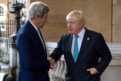 US Secretary of State John Kerry, left, is greeted by British Foreign Secretary Boris Johnson ahead of a meeting on the situation in Syria, at Lancaster House in London, Sunday Oct. 16, 2016. Renewed international efforts to solve the conflict in Syria, heightened by the plight of people in the city of Aleppo, have made little progress but more talks are planned. ( JUSTIN TALLIS / Pool via AP)