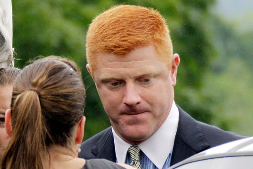 FILE - In this June 12, 2012, file photo, former Penn State University assistant football coach Mike McQueary arrives at the Centre County Courthouse in Bellefonte, Pa. McQueary's defamation and whistleblower lawsuit against Penn State over how it treated him for complaining about assistant football coach Jerry Sandusky sexually abusing a boy in a team shower is scheduled to go to trial Monday, Oct. 17, 2016, with opening statements in a courthouse near the university campus. (AP Photo/Gene J. Puskar, File)
