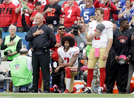 San Francisco 49ers quarterback Colin Kaepernick (7) kneels during the national anthem before an NFL football game against the Buffalo Bills on Sunday, Oct. 16, 2016, in Orchard Park, N.Y. (AP Photo/Mike Groll)
