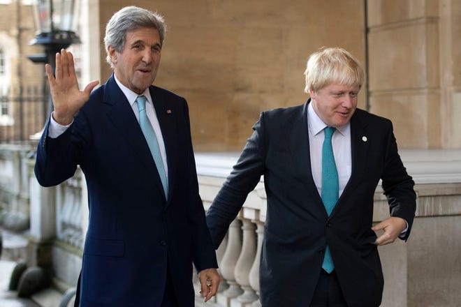 US Secretary of State John Kerry, left, waves as he is greeted by British Foreign Secretary Boris Johnson ahead of a meeting on the situation in Syria, at Lancaster House in London, Sunday Oct. 16, 2016. Renewing the international effort to solve the conflict in Syria, heightened by the plight of people in the city of Aleppo, have made little progress but more talks are planned.