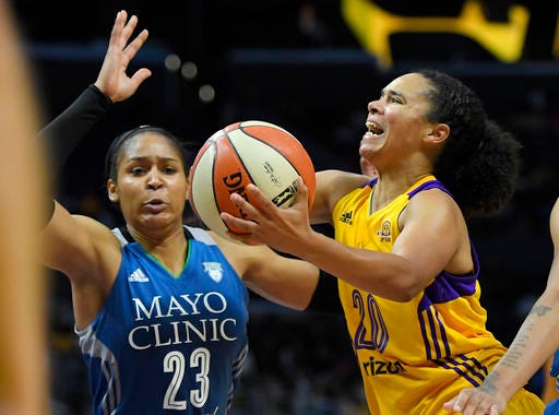 Los Angeles Sparks guard Kristi Toliver, right, shoots as Minnesota Lynx forward Maya Moore defends during the second half in Game 4 of the WNBA Finals, Sunday, Oct. 16, 2016, in Los Angeles. The Lynx won 85-79. (AP Photo/Mark J. Terrill)