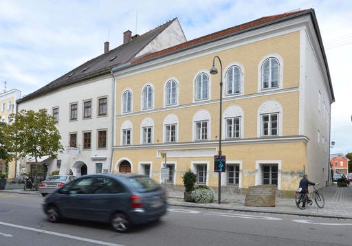FILE - This Sept. 27, 2012 file picture shows an exterior view of Adolf Hitler's birth house, front, in Braunau am Inn, Austria. Austria's government said on Monday, Oct. 17, 2016 that it plans to tear down the house where Hitler was born and replace it with a new building. (AP Photo / Kerstin Joensson, File)