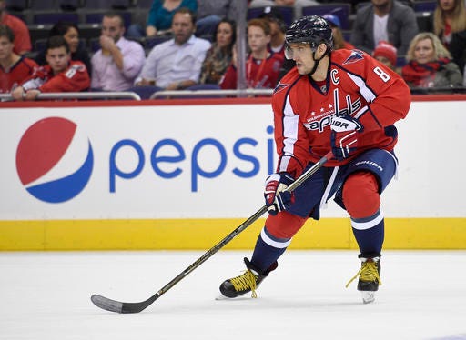 In this photo taken Oct. 3, 2016, Washington Capitals left wing Alex Ovechkin (8), of Russia, skates during overtime in an NHL preseason hockey game in Washington. Ovechkin and the Washington Capitals"™ power play is 0 for 8 through the first two games of the NHL season. Ovechkin has led the league in power-play goals the past four seasons while the Capitals have been a top-five unit. (AP Photo/Nick Wass)