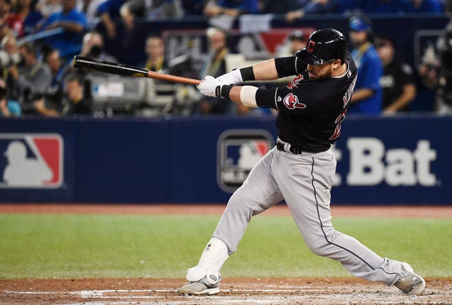 Cleveland Indians' Jason Kipnis (22) hits a solo home run against the Toronto Blue Jays during sixth inning, game three American League Championship Series baseball action in Toronto on Monday, Oct. 17, 2016. (Nathan Denette/The Canadian Press via AP)