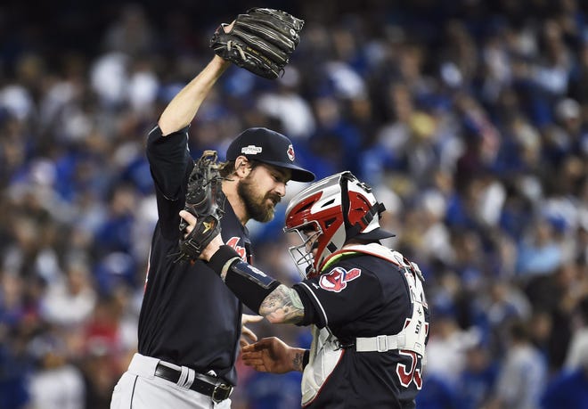 Cleveland relief pitcher Andrew Miller and catcher Roberto Perez celebrate their victory over the Blue Jays in game three of the American League Championship Series Monday night in Toronto. NATHAN DENETTE/THE CANDIAN PRESS VIA AP