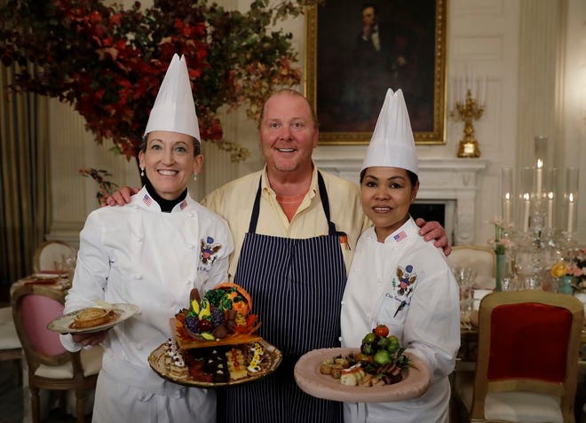 From left, White House Executive Pastry Chef Susan Morrison, American chef Mario Batali, and White House Executive Chef Cris Comerford pose for photographers during a preview in advance of the State Dinner in honor of the Official Visit of Italian Prime Minister Matteo Renzi and his wife Agnese Landini, Monday, Oct. 17, 2016, in the State Dining Room of the White House in Washington.