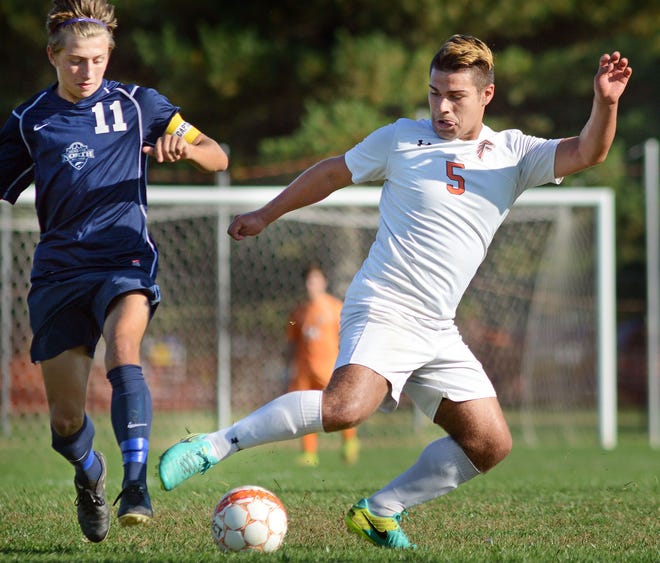 Pennsbury's Javier Sosa (5) dribbles the ball around Council Rock North's Conor O'Donnell in the first half against Tuesday, October 18, 2016, at Pennsbury High School in Falls.