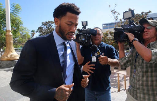 FILE - In this Thursday, Oct. 6, 2016, file photo, New York Knicks basketball player Derrick Rose arrives at U.S. District Court in downtown Los Angeles. The lawsuit alleging NBA star Rose and his friends raped an incapacitated woman is all about consent. Jurors who return to court Tuesday, Oct. 18, for the civil trial will have to determine whether the woman agreed to sex or was too incapacitated to do so. (AP Photo/Damian Dovarganes, File)