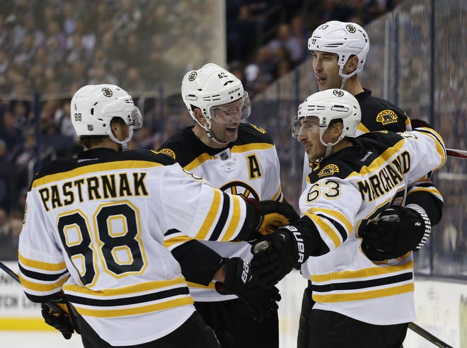 David Patrnak (left), David Backes (second from left), and Brad Marchand (front right) were all a plus-7 on the Bruins' season-opening three-game road trip while Zdeno Chara (rear right) was a plus-6 as Boston took two out of three.