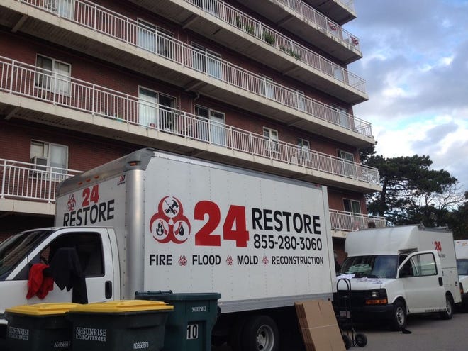 Disaster-restoration crews worked at O'Brien Towers on Monday as the Quincy Housing Authority worked to eradicate the latest bedbug infestation.