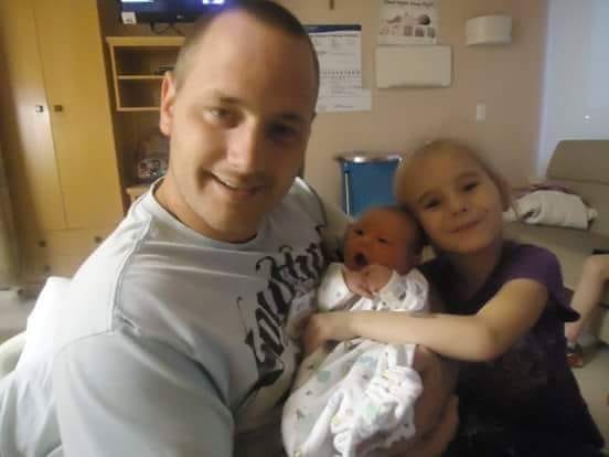 Larue Scheib is pictured with his children. Submitted photo