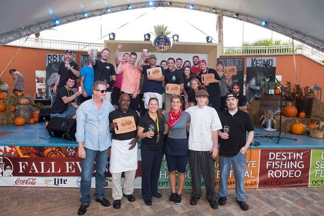 Winners at last year's Blues, Brew and BBQ Festival celebrated their success. SPECIAL TO THE LOG
