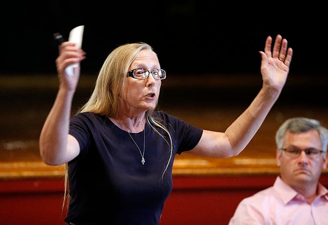 Jeanne Holmes speaks during the Aquaria meeting at the West Junior High School in Brockton on Thursday, Aug.20, 2015.