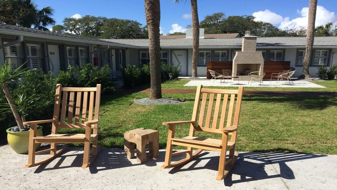 The newly renovated Hotel Palms, formerly the Palms Retro, offers lounge chairs, an outdoor shower, an isokern fireplace and an ipe wood walkway in its courtyard. (Giuseppe Sabella/Florida Times-Union)