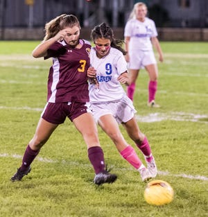 Fairhaven's Elizabeth Vanasse and Case's Megan Borges battle for the ball on Wednesday. The teams battled to a 1-1 South Coast Conference tie. RYAN FEENEY/STANDARD-TIMES/SCMG