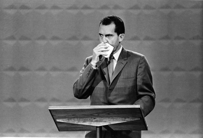 In this Sept. 26, 1960, file photo U.S. Republican presidential candidate Vice President Richard M. Nixon wipes his face with a handkerchief during the nationally televised first of four presidential debates with Sen. John F. Kennedy, Democratic nominee, in Chicago. It was the first televised debate between presidential candidates in U.S. history. Nixon's profuse sweating on stage with cool-as-a-cucumber rival John Kennedy (not shown) in 1960 proved to be stiff competition in the pantheon of campaign misfires. AP FILE