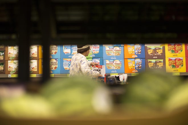 A shopper browses the cereal section at an Aldi food market in Inglewood, Calif. Sales of cold and hot cereals this year are projected to have fallen 17 percent from 2009. Los Angeles Times/TNS/Gina Ferazzi