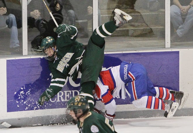 Bishop Hendricken's Shane Kavanagh knocks down a Mount St. Charles player during the state championship series in 2011.
