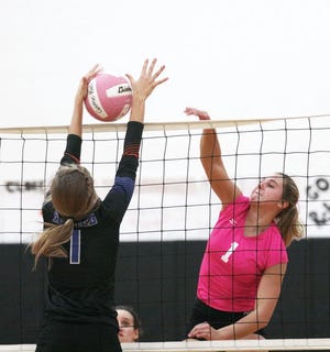 Paige Andrews of Sturgis hammers home a kill against Edwardsburg on Thursday night.