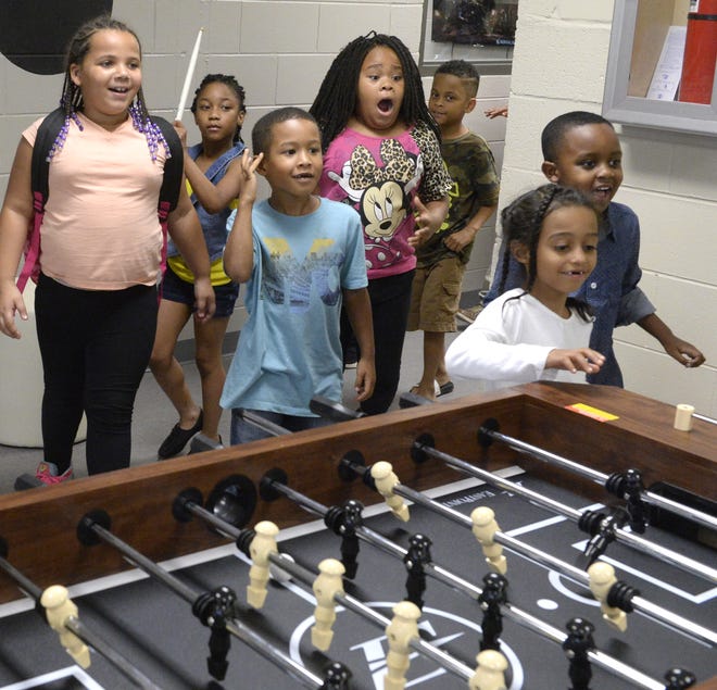 Children react as they seen the new Boys and Girls Club for the first time during the grand opening celebration of the new permanent location, Thursday, Oct. 20, 2016, in Gadsden, Ala. The William Thomas Dawson Unit is located in the former General Forrest Middle School. (Marc Golden/ Gadsden Times)