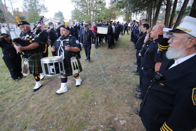 EMT James "Jimmy" Shields was buried on Thursday in the Hebrew Aide Society Cemetery in Harris. In addition to family and friends, several hundred EMTs and fire department personnel attended. PHOTOS BY JIM SABASTIAN/FOR THE TIMES HERALD-RECORD