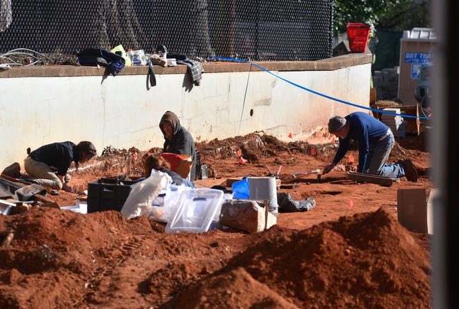 Workers excavate a construction site behind Baldwin Hall on the University of Georgia campus where several gravesites from the Old Athens Cemetery were recently found on Thursday, Jan. 7, 2016. 
(File/Staff)