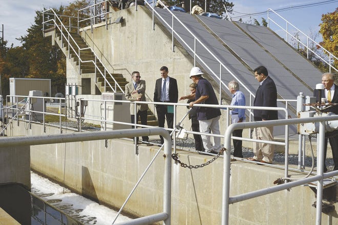 State General Treasurer Seth Magaziner, second from left, listens as Tom Ciolfi (in hardhat) speaks during a tour Thursday of the Newport wastewater treatment plant. Councilwoman Lynn Underwood Ceglie is behind Ciolfi and Councilman Marco Camacho is second from the right. City Manager Joseph J. Nicholson Jr. is at the right.