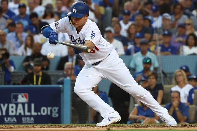 Joc Pederson of the Dodgers tried to bunt for a hit in the second inning on Thursday night, but Cubs pitcher Jon Lester threw him out.