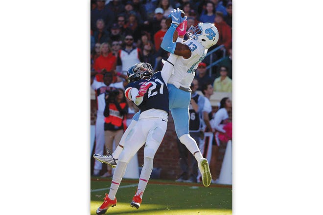 North Carolina wide receiver Bug Howard hauls in a touchdown pass in front of Virginia safety Juan Thornhill during the first half Saturday at Scott Stadium in Charlottesville, Va.