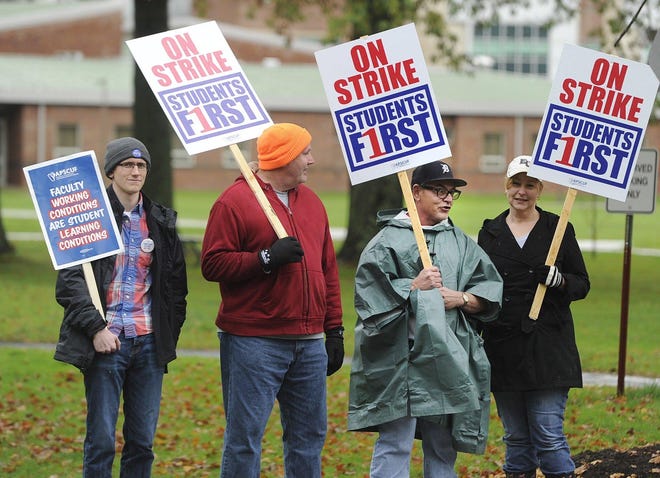 Edinboro University of Pennsylvania student Kevin Shuman, left, and faculty members Richard Lloyd, Rick White and Leslie Soltis, picket Thursday on campus. A three-day faculty strike at Edinboro and 13 other state-owned colleges and universities ended Friday afternoon. JACK HANRAHAN/ERIE TIMES-NEWS